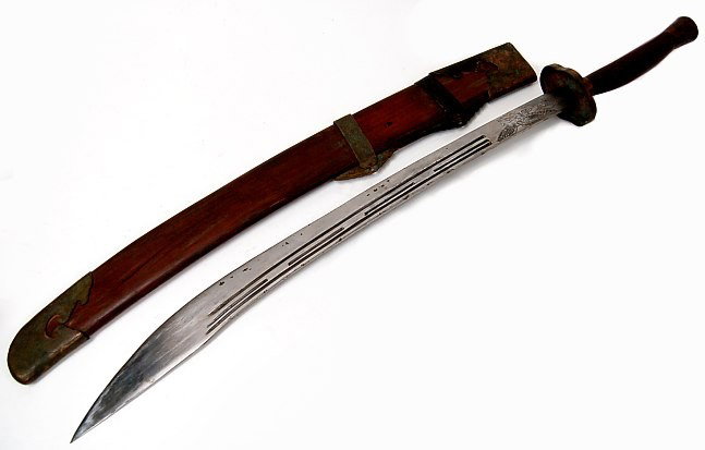 Chinese ox-tail Dao sword: Chinese ox-tail Dao sword having a 29" blade with an engraved flying eagle, engraved copper daodaang, bingtou and tiliang'gu, measuring 38" long, early 20th cen.