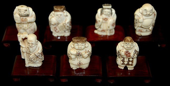 Chinese carved ivory 7 immortals: Chinese carved ivory 7 immortals on wooden scroll stands, measuring 1.7" tall