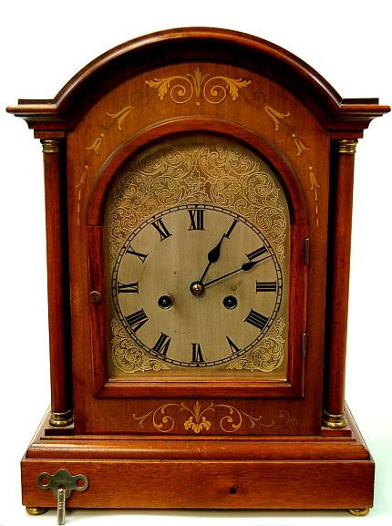 Fruitwood inlaid 8 day regulator clock: Fruitwood inlaid 8 day regulator clock with presentation sentiment on the reverse c.1914, having a 4 bell strike, the clock is working and keeping time