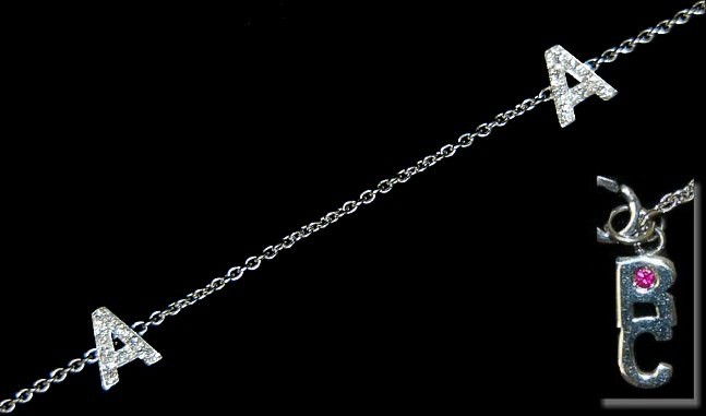 18K Roberto Coin initial "A" diamond necklace: 18K Roberto Coin initial "A" necklace set with 60 diamonds pavÃ© set on both sides of the 5 "A" initials, MINT condition, retailed at $2,495.00 from a defunct Scottsdale jewelry store
