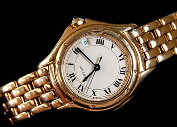 101: Cartier lady's 18K Panther watch