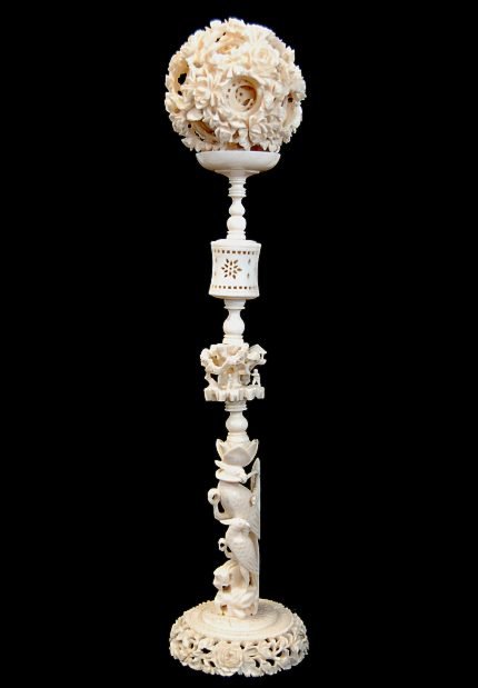 Chinese carved ivory 13.5" mystery ball on stand, h: Chinese carved ivory 13.5" mystery ball on stand, having 10 balls within the largest, each with different patterns, one ball shattered