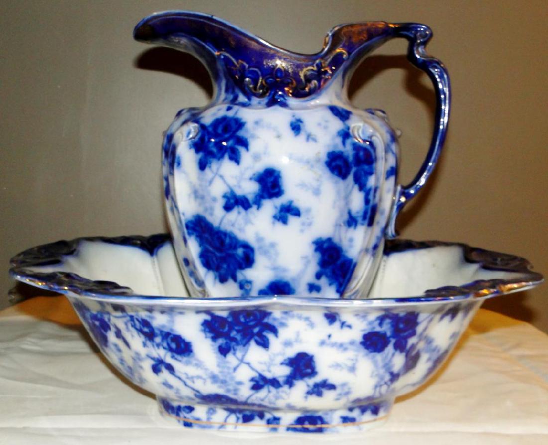 Flow Blue Charles Meigh Pitcher & Bowl Set: Flow Blue Charles Meigh Pitcher and Bowl Set, marked C M S with registration mark 2590. Bowl and pitcher are a matching set with floral decoration and gold trim, excellent condition (bowl-5.5"h x 18";