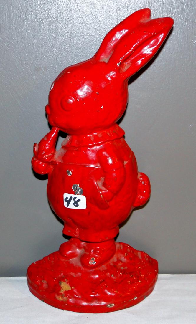 Antique Cast Iron Rabbit Door Stop: Cast iron rabbit door stop, eating a carrot, antique, painted red (9.5"h x 5").