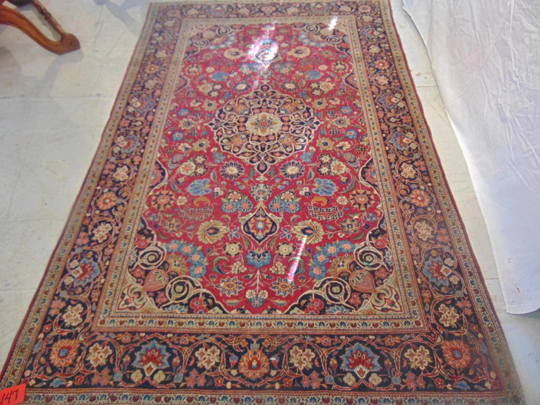Middle Eastern Antique Rug: Middle Eastern rug, hand tied, antique, flowers in cream, umber and blue, good condition (83" x 51.5").