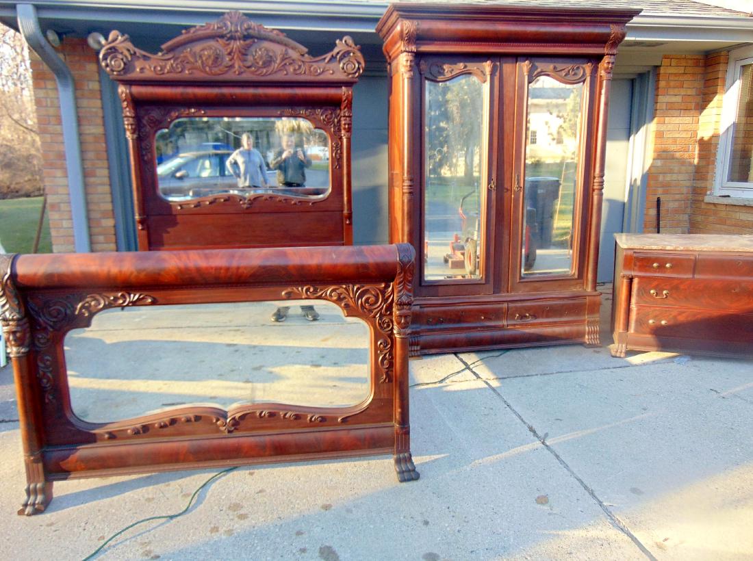 Victorian Bedroom Suite Dirty Helen Milwaukee: Victorian bedroom suite, includes: an outstanding bed, heavily carved with heads, and unusual serpentine beveled glass mirrored headboard and footboard; large carved and mirrored wardrobe with elabora