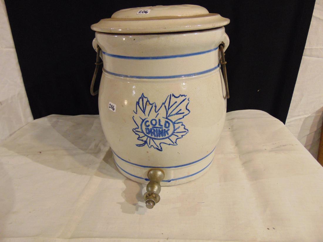 Stonware water cooler: Stoneware water cooler, Western maple leaf, blue band . Has a Redwing 2 gallon stoneware cover. 11-1/2" tall, 10" aross, in good condition.