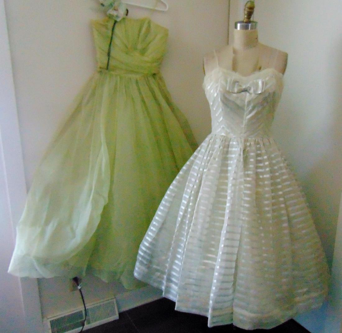 Vintage 1950's Cocktail Dresses: Vintage 1950's ladies cocktail dresses to include: a silk and striped white organza dress, bow detail on bodice; along with a green silk and chiffon dress, beautiful draped bodice, tear and minor repa