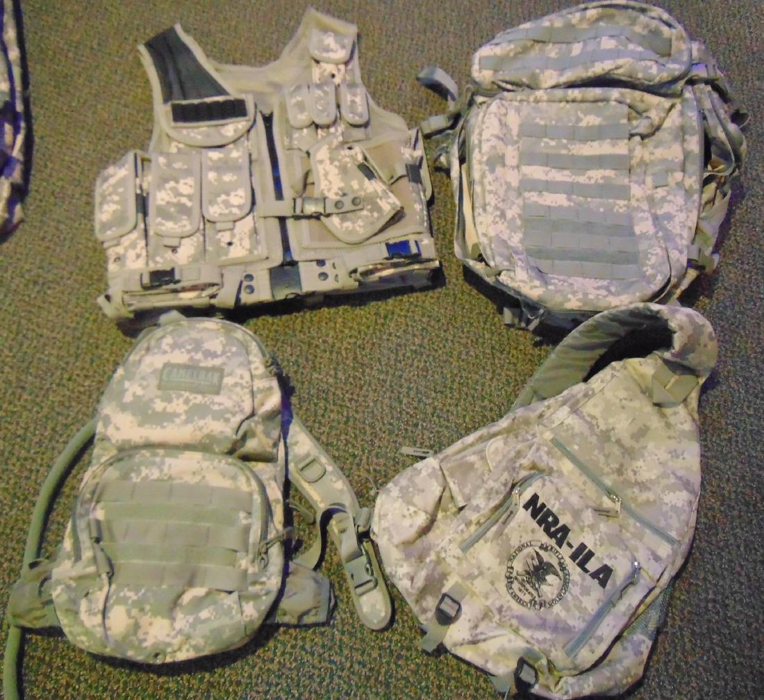 Group of Camouflage: Group of Camouflage to include: a vest; backpack; water holder; and shoulder backpack.