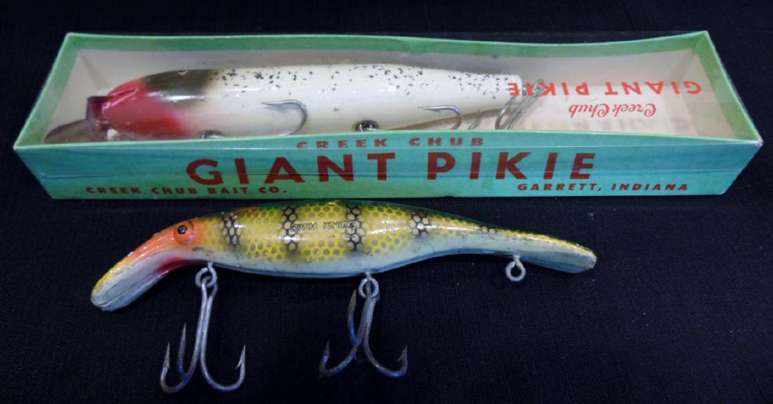 Giant Pikie & Swim Wizard Vintage Fishing Lures: Giant Pikie fishing lure by Creek Chub Bait Co., Garrett, IN No. 6108W, from the 1950's, in original package, never used (8.5", package 12.5" x 2"); along with a Swim Wizard by Homer LeBlank Tackle Ma