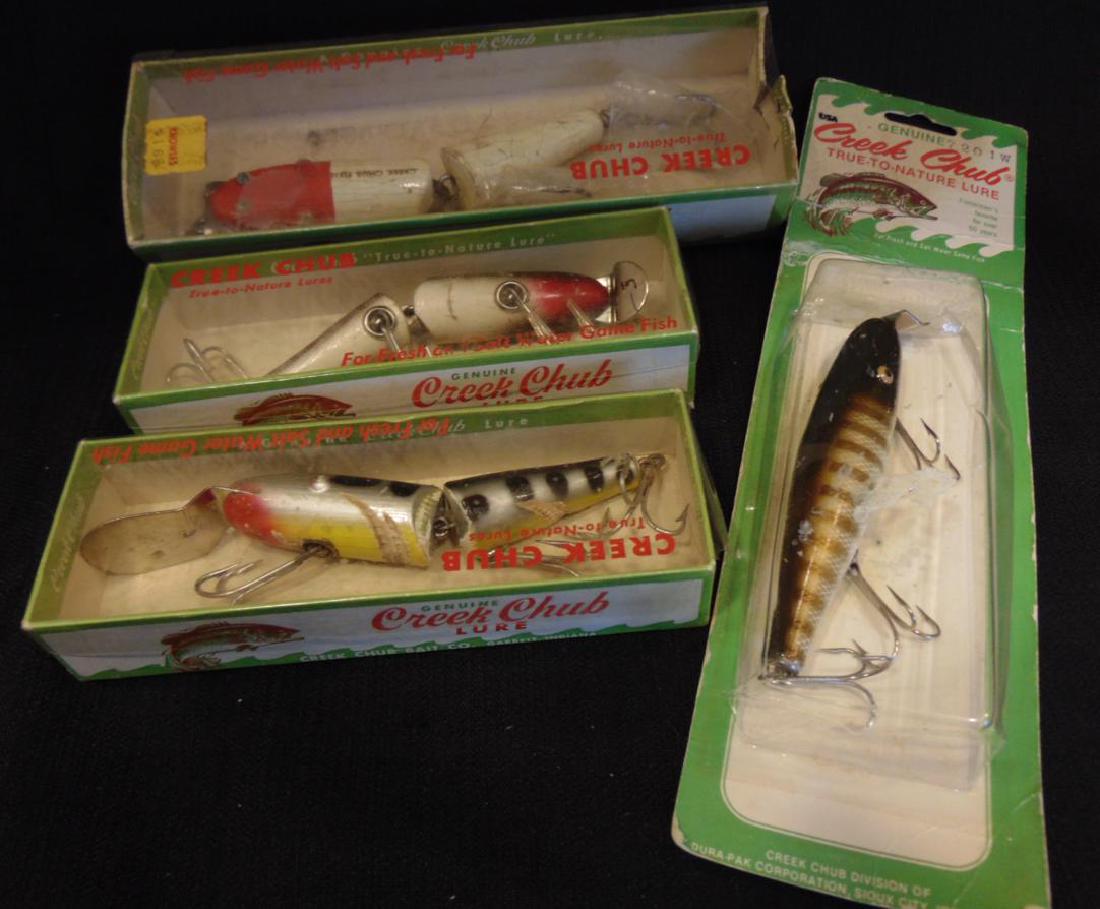 Fishing Lure Group 1950's Creek Chub Original Packaging: Group of 4 fishing lures from the 1950's, in original packaging to include: Creek Chub by Creek Chub Bait Co., Garrett, IN No. 5502; Creek Chub by Creek Chub Bait Co., Garrett, IN No. 2614DD; Creek Ch