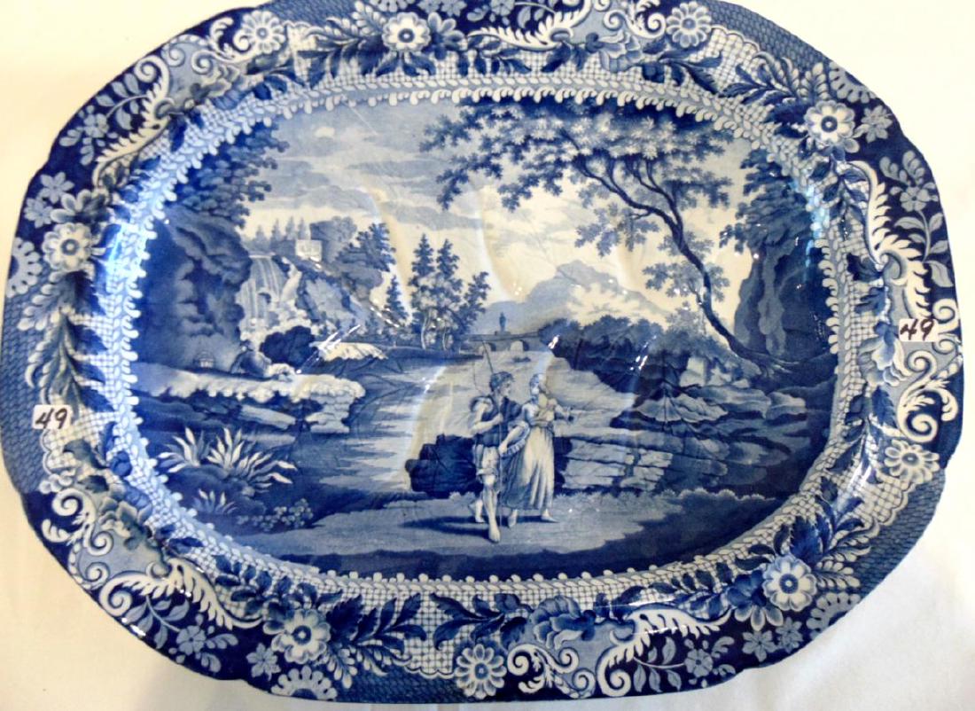 Blue Transferware Turkey Platter, Castle of Rochefort: A rare and large blue transferware footed turkey platter signed on back Castle of Rochefort South of France with incised markings. This outstanding large platter has a built in draining bowl and depic
