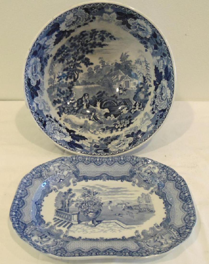 Antique Staffordshire Center Bowl & Spode Platter: A large blue and white antique Staffordshire center bowl with Scenic Interior (5.5" h x 11" r) depicting rose exterior and interior man playing flute with goats by the river along with a Copeland Spod