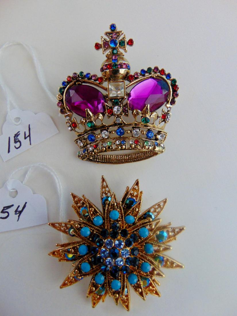 Rhinestone Multi Colored Brooches: 2 large Rhinestone multicolored brooches depicting a Crown and a Starburst