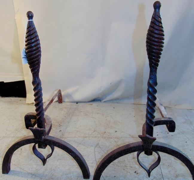 Pair of New England Andirons: This hand wrought pair of Folk Art Andirons has Barley Twist Poles and heart trimmed motif. They measure 20.5"Tx20"D