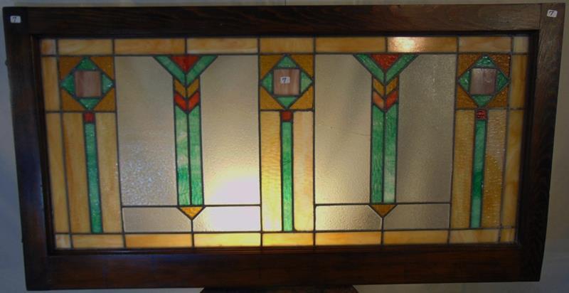 Mission Arts and Crafts Plano Window: This is a Mission Arts and Crafts Oversided multi-colored Piano Window. This Geometric pattered stain glass window is set in a pine frame and measures 23"Tx44"L.