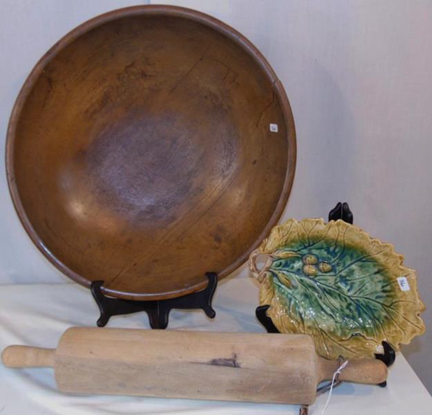 Large Wooden Dough Bowl and more: A large wooden bowl that is 19"A along with a wooden rolling pin that is 24"Lx4"H. Included is a Magelica Dish that is 11"Lx9"W.