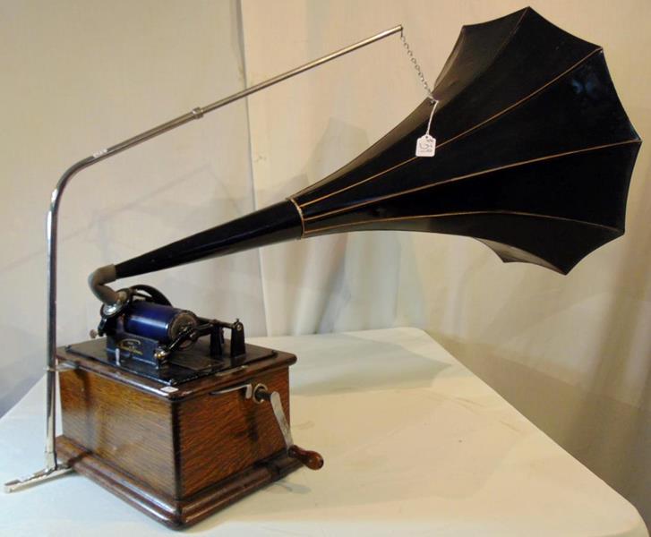 Edison Wax Cylinder Victrola: This hand crank was cylinder Victrola from the Edison Company has an oak case and gilted Edge bell. The case measures 6"Tx12"Lx9"D