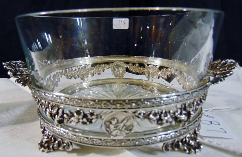 Sterling and Crystal Fruit Bowl: Elaborate Sterling and Crystal Fruit Bowl is an Antique Footed Sterling and Diamond Cut Crystal Bowl measuring 3.75"Tx9"W. Weighs ~ 210 gm.