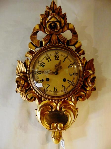Giltwood Key Wind Wall Clock: Carved Giltwood Hollywood Regency Key Wind Wall Clock.(no pedulum) This Gold Pierce Carved Wall clock measures 21"Tx12.5"Wx4.25"D.