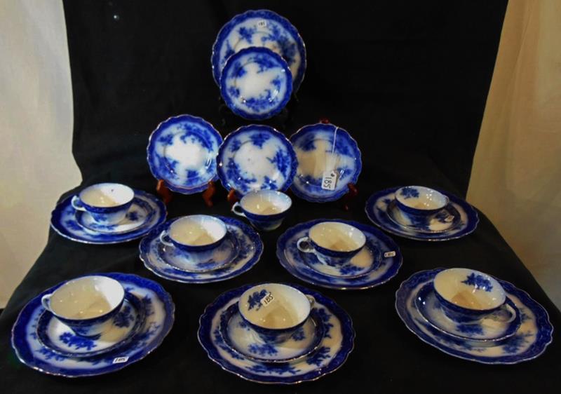 Flow Blue: Flow Blue in the Tourain Pattern by Stanley Pottery Co. to include 8 cups, 7 saucers, 8 bread and butter plates, and a luncheon platter.