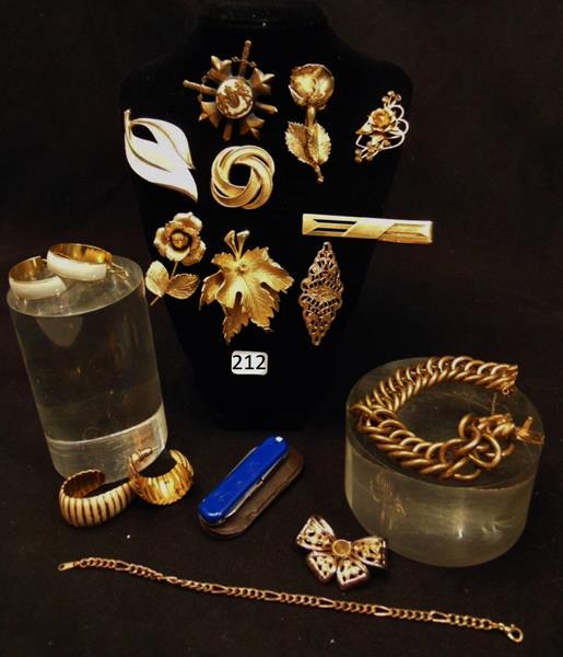 Quality Costume Jewelry: Lot of Quality Costume Jewelry to include a Sterlling Rose Brooch, 8 other Broochs, Monet, 2 pair of Earrings, Men's Money Clip, Men's Heavy Chain Bracelet, and more.