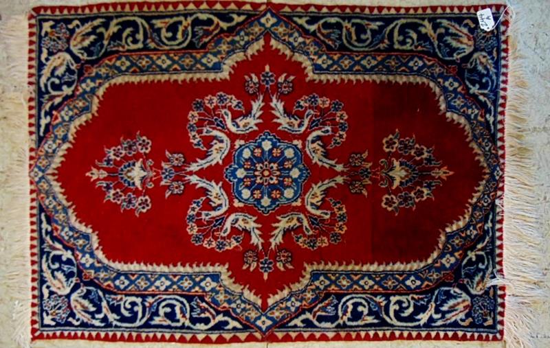 Prayer Rug: Very Finely Knotted Wool and Silk Middle Eastern Prayer Rug; Finely Woven with very Elaborate Floral Decorations and Center Field in Burgandies and Blues. This Rug measures 39"lx28"W.