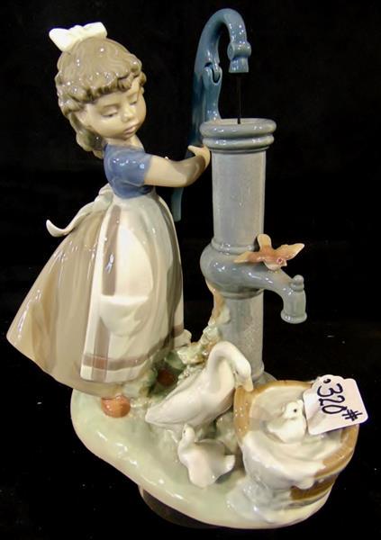 Oversized Lladro Figurine: Lladro Oversized Porcelein Mult-colored Figurine depicting a Little Girl using a Hand Pum to give Birds a Bath in Excellent condition. This Lladro Porcelein Figure measures 10"Tx8"W.