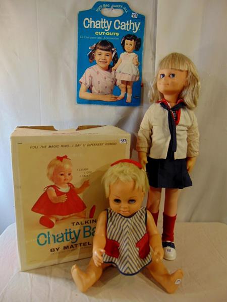 Chatty Cathy Doll: Chatty Cathy Doll with Original Coths along with Chatty Baby by Mattel in Original Clothing and Box and Chatty Cathy Cut-outs. Included is Chatty Baby Wardrobe Carrying Case that measures 13.5"Tx12.5"