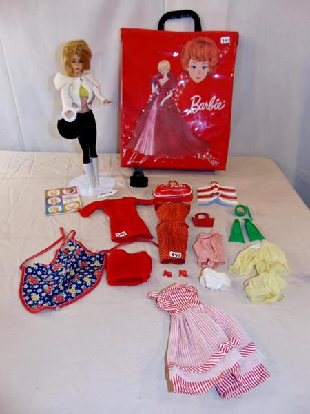 Mattel Early '60's Barbie Doll: Early 60's Barbie Doll by Mattel with carrying case, an outfit order book, and various outfits and accessoories to include high heels, British Airways bag, scuba snorkle set and flippers, high heels,