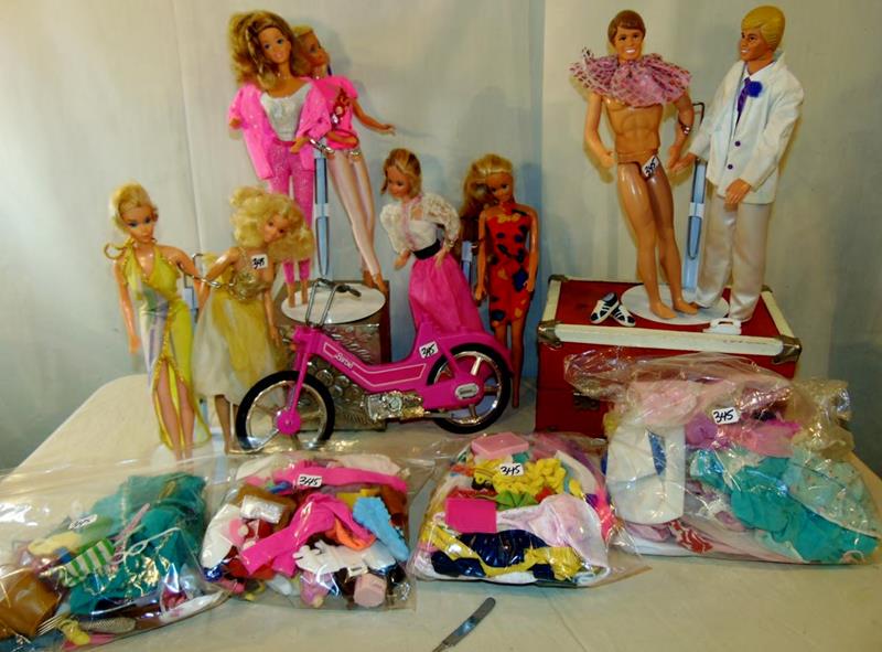 Lot of Barbie & Ken dolls: Large Lot of Barbie and Ken Dolls by Mattel, to include: 6 1980's Barbie Dolls and 2 1980's Ken dolls, a Barbie motorcycle (missing seat), and four bags of outfits and accessories (includes dresses, s