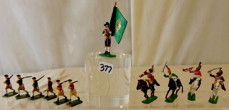 Hand Painted Toy Soldiers: Hand Painted Colonial or French Toy Soldiers; 6 Standing Soldiers and 4 Calvary Soldiers along with one Flag Bearer. Soldiers on horseback measure approx, 2"T and the marching soldiers measure 125"T.