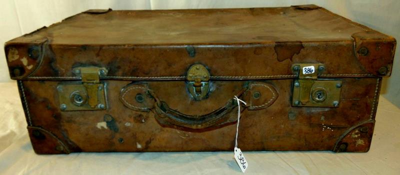Vintage Leather Suitcase: Vintage Leather Suitcase with Brass Hardware, Rivited Leather Corner Protetion, and Original Travel Stickers. This leather suitcase measures 16"Tx25.5"Wx9"D.