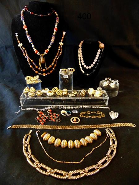 Large Group of Quality Designer Costume Jewelry: Large group of quality designer costume jewelry to include Kenneth Jay Lane, Trifari, Monet LaRosse, Napier, and Ciner. This grouping contains 13 pairs of clip earrings, 9 necklaces, 3 brooches, 2 bra