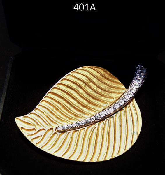 Kenneth Jay Lane Leaf Brooch: Kenneth Jay Lane oversized Leaf Brooch with Rhinestone encrusted Stem. This exceptionally leafed Denneth Jay Lane Leaf Brooch is in excellent condition and Signed on the back. It measures 2.25"Tx3.5"W