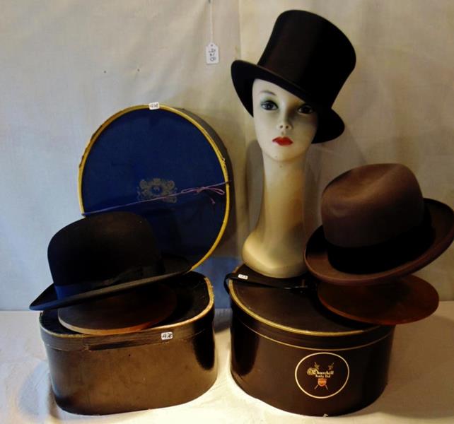 Top Hat and Bowler: Collapsable Marshall Fields Top Hat with the original Box; a Dobbs Bowler with it's Hat Box; a Herbert Johnson of New Bond Street London, by Appointment Only to the Queen for Marshall Field & Company.