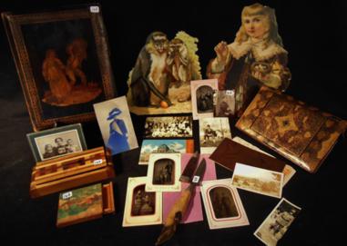 Large Group of Ephemera: Large group of ephemera to include a Victorian inlaid fruitwood desk organizer depicting a maiden and a harvest man, a leather Italian tooled letter carrier, tin types, lidded cigarette box, deer hoof
