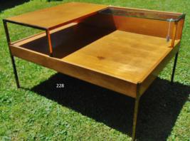 MCM Paul McCobb Corner End Table: This MCM Paul McCobb planner group corner end table is honey maple with brass legs and accents and a glass shelf. A wonderful example of '50's modern furniture. A small stain on lower shelf and some s