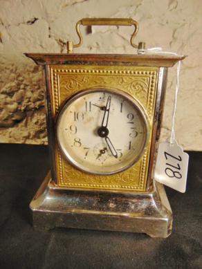 Turn of the Century German Musical Carriage Clock: This Victorian German musical carriage clock of flourished brass has a second hand and an alarm dial and accents around the corners. It retains it's original key. The measurements is 6"Tx5.5"Wx4"D. Co