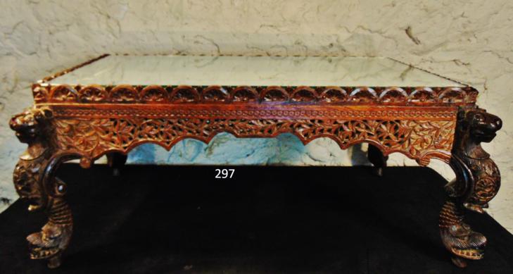 1800's Hand Carved Moroccan tea Table: This 1800's Moroccan hand carved teak tea table has an etched mirror top and profusely carved base which features lion corners, serpent carved feet, and floral pierced carved sides. It measures 15"Tx3