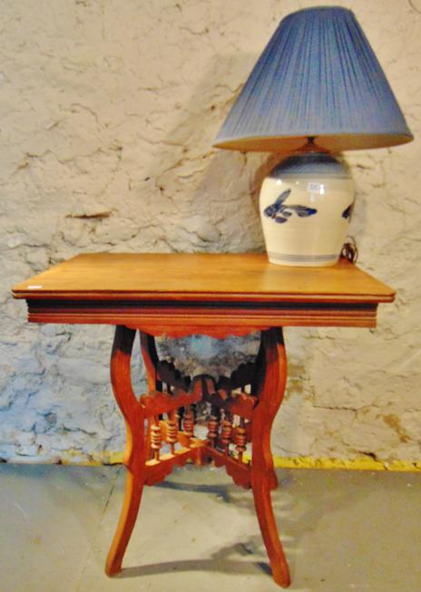 1890's Spindle Parlour Table and Saltware Lamp: This 1890's Oak spindle parlour table and cobalt pottery lamp with shade and decorated in Koi are in excellent condition. Table is 28"Tx29"Wx21.5"D and the lamp is 22"T.