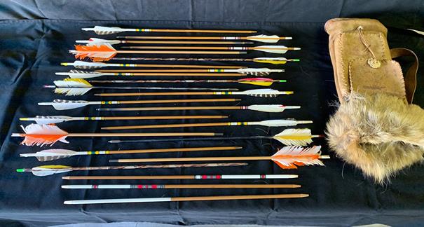 Lot of Arrows and leather quiver to include wood and: Lot of Arrows and leather quiver to include wood and composite arrows, 24 total. Some include tips and feathers.