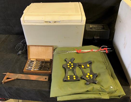 Camping lot to include - 12v cooler/regridgerator, 12v: Camping lot to include - 12v cooler/regridgerator, 12v portable camping stove, knife set, traction cleats, blanket, and outdoor hangar (all untested)