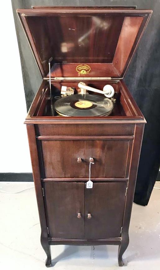 Columbia Grafonola Standing Victrola: This working Columbia Grafonola standing Victrola is in a mahogany case with a big sound. It has a record cabinet underneath. It measures 43" tall x 19" across x 21" deep.