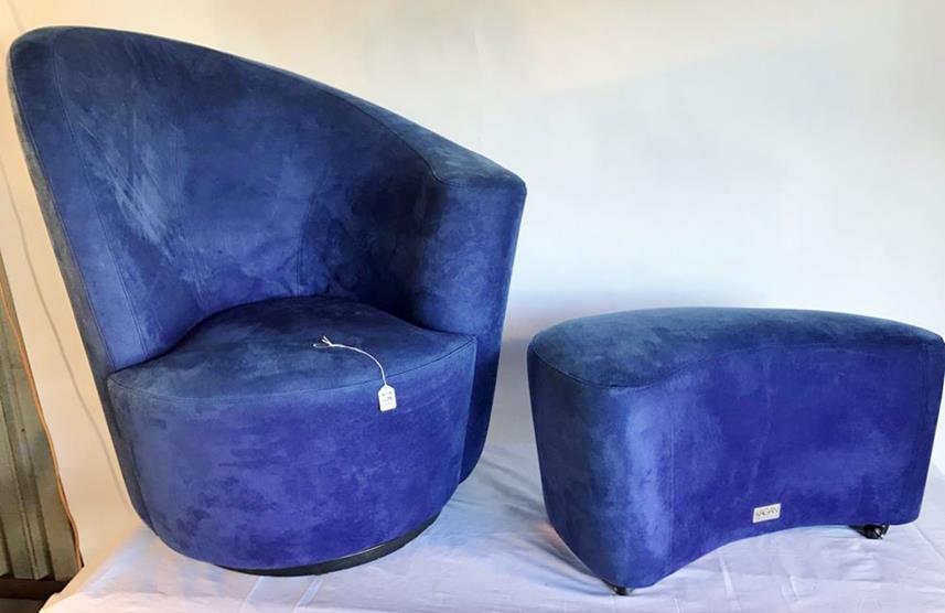 Vladimir Kagan Swivel Chair and Matching Ottoman: This Vladimir Kagan suede covered swivel chair has a matching ottoman on castors. Each piece has a signed metal plate which reads KAGAN, NEW YORK COLLECTION. This exceptional modern chair measures 40"