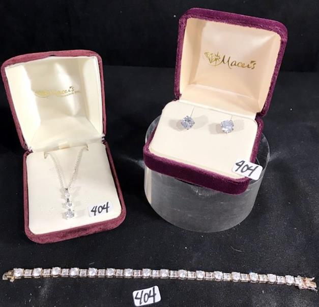 New/Old Stock of Sterling to include Earrings, Bracelet: This group of Sterling Silver New/Old stock is set with brilliant white stones and include a pair of solitaire pierced earrings, a cascade 3 stone necklace on a fine chain, and a bracelet with alterna
