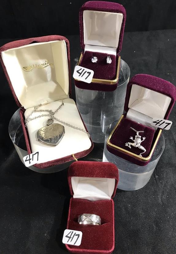 Group of New/Old Sterling Silver Jewelry: This group of New/Old quality Sterling Silver jewelry include a heart locket on a 16" chain, a frog pendant on a fine Sterling chain, a pair of crystal pierced earrings, and a faceted ring.