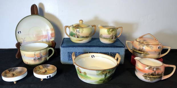 Group of Hand Painted Nippon and Noritake China: This group of hand painted Nippon and Noritake includes two sugar and creamer sets depicting nature scenes (the second seet is Noritake), an oversized Nippon cup and saucer depicting boats on water, t