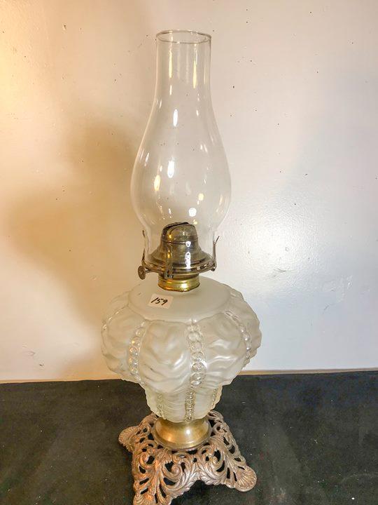 Lincoln Drape Oil Lamp with 4 footed Ornate plinth: This 19th Century oil lamp has a satin glass and clear Lincoln Drape patterned fount, Scovill thumbwheel, and an ornate 4 footed open worked plinth. It measures 19" tall X 8" across.