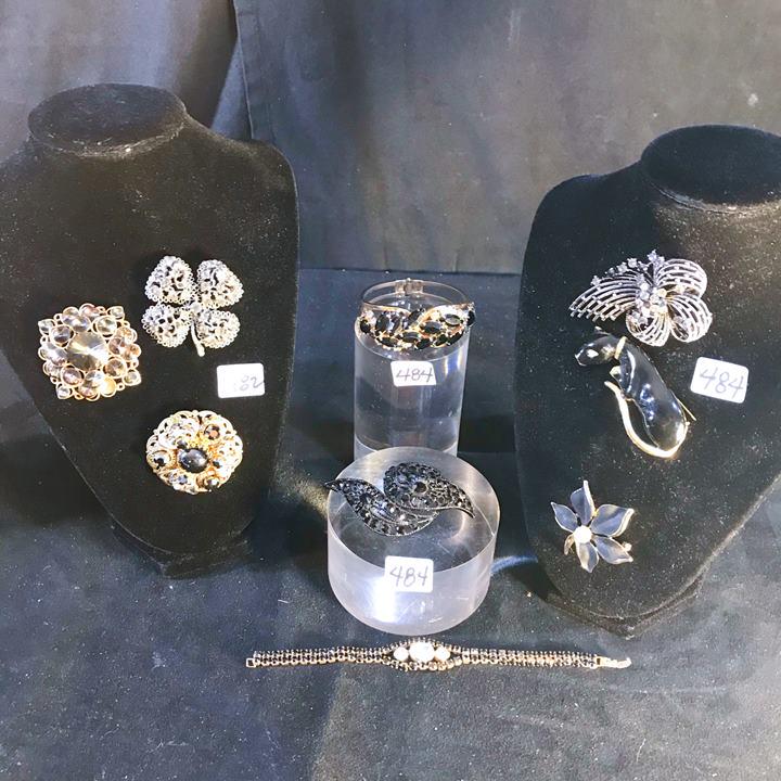 Group of Midcentury Colored Rhinestone Pins Earrings,: This group of colored rhinestone jewelry includes a pair of Monet sapphire colored clip earrings, a brooch and matching clip earring set, 3 floral brooches, an airplane brooch, a pair of long teardrop